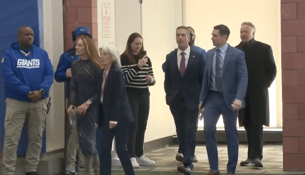 People walking in an indoor facility.